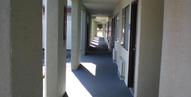 link to full image of The Redwood Riverwalk Hotel exterior hallway